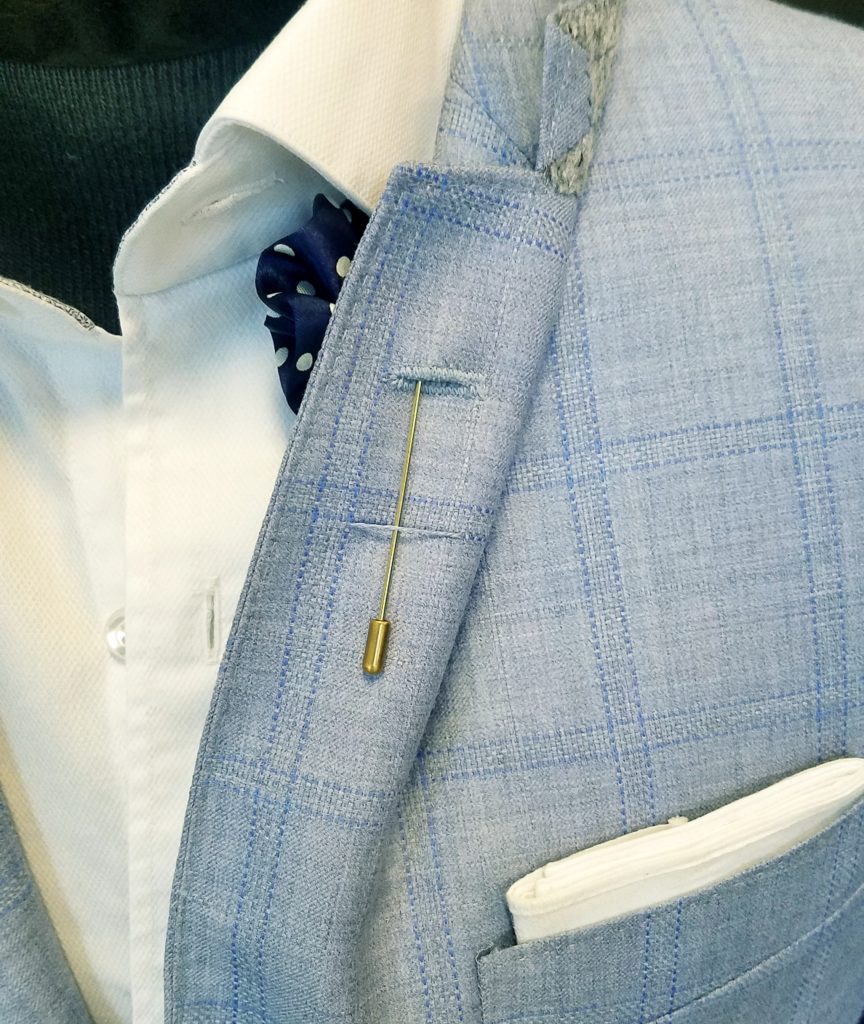 under a suit jacket lapel